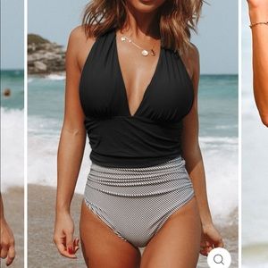 Swimod one piece swimsuit. Brand new/never worn. Panty liner still intact.